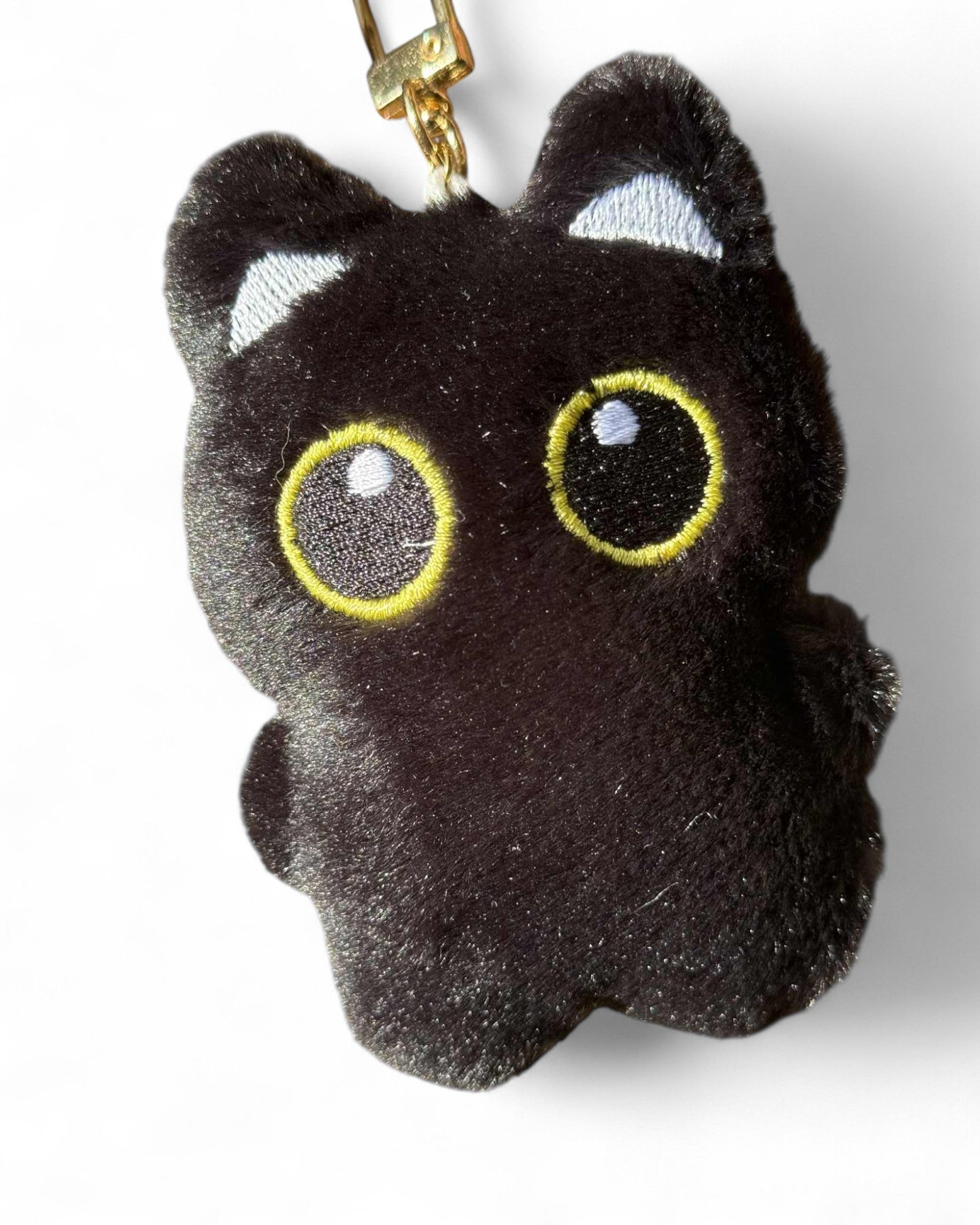 Grigri chat noir et sa tétine rose